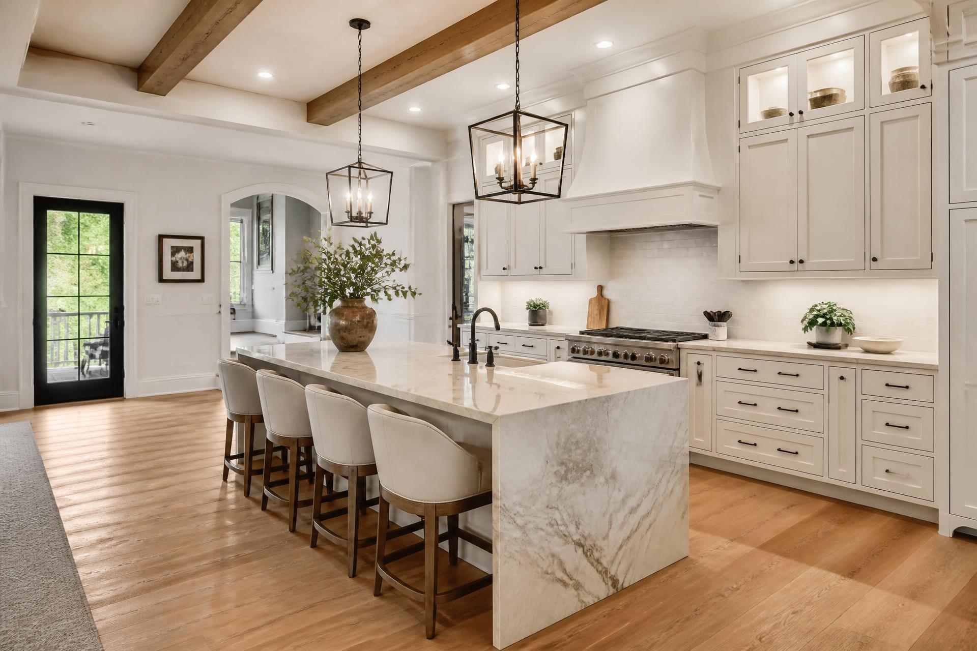 Custom luxury kitchen with wood beams and marble island